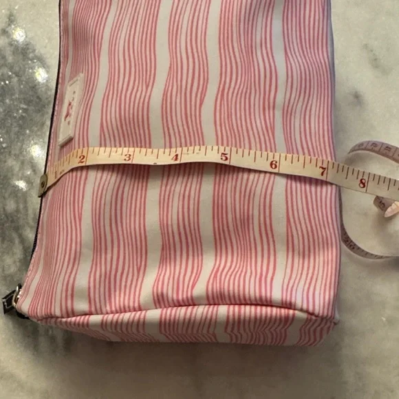 SCOUT Packin' Heat Makeup Bag featuring a pink and white wavy stripe pattern. - Picture 11 of 15